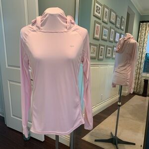 Small light pink pullover hoodie with thumb holes, pocket and face sun shield.